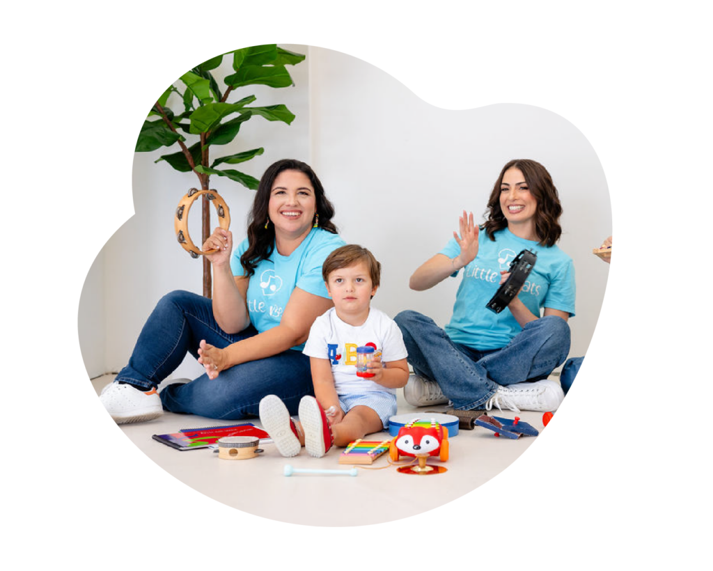 two women music teachers with child in the middle